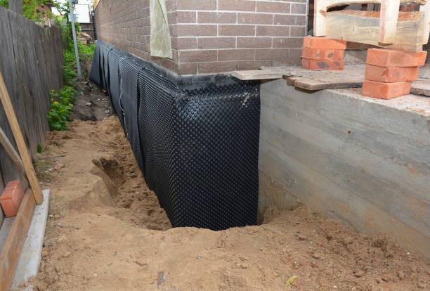 Happy homeowners after waterproofing job in Wolcottville